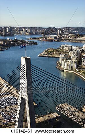Aerial view of Anzac Bridge and buildings by harbour in Sydney, Australia. View Large Photo Image Stock Image - Aerial view of Anzac Bridge and buildings by harbour in Sydney, Australia.. Fotosearch