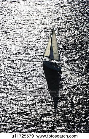 Aerial view of backlit sailboat in Sydney, Australia. View Large Photo Image Stock Photo - Aerial view of backlit sailboat in Sydney, Australia.. Fotosearch