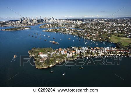 Picture - Aerial view of boats in Snails Bay with view of downtown skyline in Sydney, Australia. Fotosearch