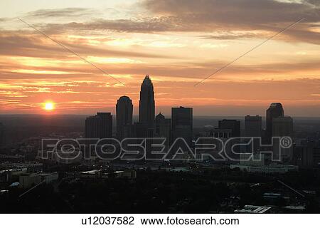 Aerial view of sunset behind city skyline of Charlotte, North Carolina. View Large Photo Image Stock Image - Aerial view of sunset behind city skyline of Charlotte, North Carolina.. Fotosearch