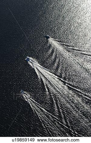 Stock Photo - Aerial view of three boats traveling together in Sydney, Australia. Fotosearch