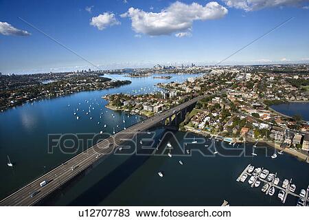 Stock Image - Aerial view of Victoria Road bridge and boats in Sydney, Australia. Fotosearch