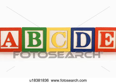 Alphabet blocks lined up in a row View Large Photo Image Stock Photograph - Alphabet blocks lined up in a row. Fotosearch