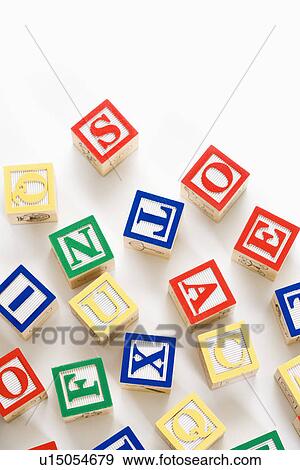 Alphabet building block scattered on white background. View Large Photo Image Stock Photo - Alphabet building block scattered on white background.. Fotosearch