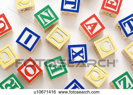 Alphabet building block scattered on white background. View Large Photo Image Stock Photograph - Alphabet building block scattered on white background.. Fotosearch