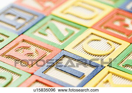 Stock Photograph - Alphabet building block toys arranged together. Fotosearch