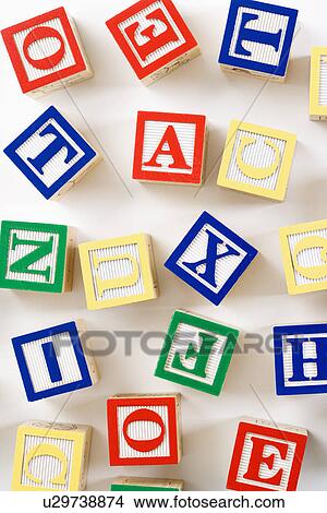 Alphabet building block toys scattered on white background. View Large Photo Image Picture - Alphabet building block toys scattered on white background.. Fotosearch