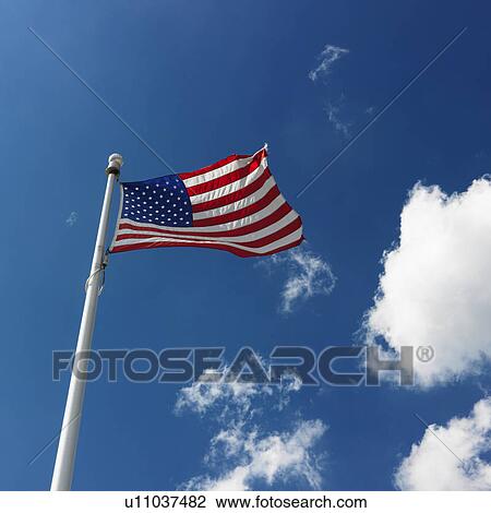 American flag flying with cumulus cloud formation in blue sky View Large Photo Image Stock Image - American flag flying with cumulus cloud formation in blue sky. Fotosearch
