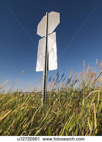 Stock Image - Back view of road sign in rural country. Fotosearch