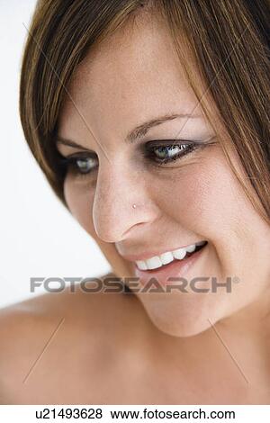 Bare Caucasian mid adult brunette woman looking to side and smiling. View Large Photo Image Stock Photo - Bare Caucasian mid adult brunette woman looking to side and smiling.. Fotosearch