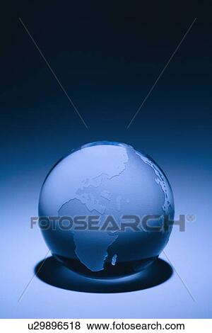 Stock Photo - Blue still life of globe showing continents of Europe, Asia and Africa. Fotosearch