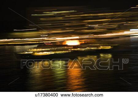 Blurred lights at night reflected on Sydney Harbour in Sydney, Australia View Large Photo Image Stock Image - Blurred lights at night reflected on Sydney Harbour in Sydney, Australia. Fotosearch