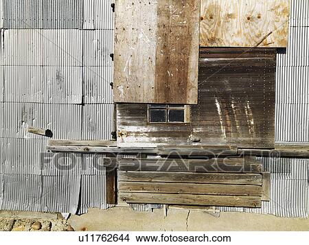 Building exterior with wood and metal siding View Large Photo Image Picture - Building exterior with wood and metal siding. Fotosearch