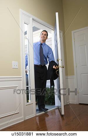 Businessman at open door with briefcase View Large Photo Image Stock Image - Businessman at open door with briefcase. Fotosearch
