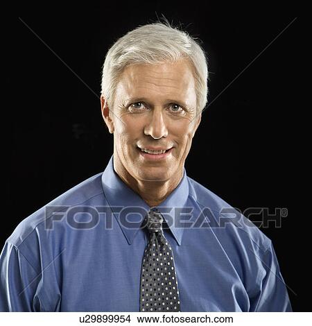 Picture - Businessman looking at viewer. Fotosearch