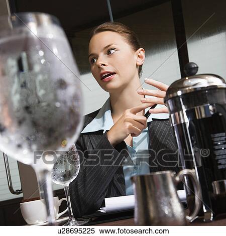 Caucasian businesswoman sitting at table with coffee and beverages. View Large Photo Image Stock Photography - Caucasian businesswoman sitting at table with coffee and beverages.. Fotosearch