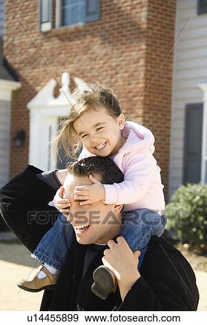 Caucasian father carrying daughter on shoulders. View Large Photo Image Stock Photo - Caucasian father carrying daughter on shoulders.. Fotosearch