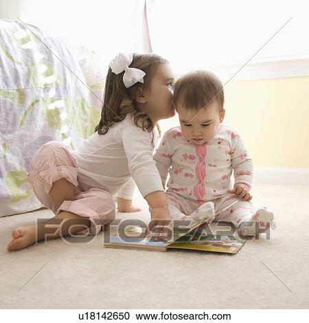 Caucasian girl children sitting on bedroom floor looking at book. View Large Photo Image Stock Image - Caucasian girl children sitting on bedroom floor looking at book.. Fotosearch