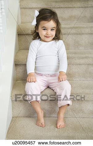 Caucasian girl toddler sitting on carpeted stairs. View Large Photo Image Stock Photo - Caucasian girl toddler sitting on carpeted stairs.. Fotosearch