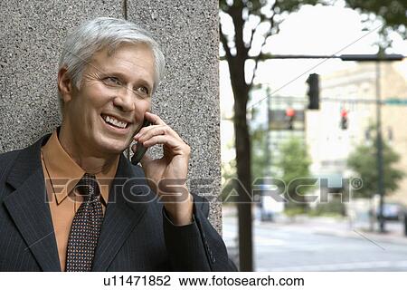 Caucasian middle aged businessman talking on mobile phone. View Large Photo Image Stock Image - Caucasian middle aged businessman talking on mobile phone.. Fotosearch
