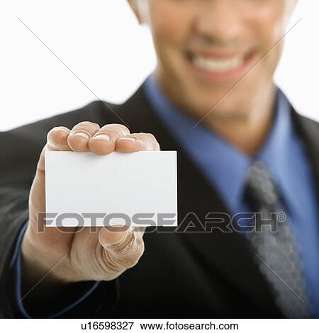 Caucasian middle aged man holding business card toward viewer. View Large Photo Image Stock Photo - Caucasian middle aged man holding business card toward viewer.. Fotosearch