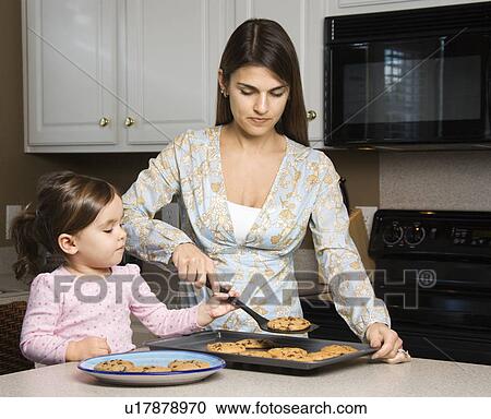 Caucasian mother and daughter with cookies. View Large Photo Image Stock Image - Caucasian mother and daughter with cookies.. Fotosearch