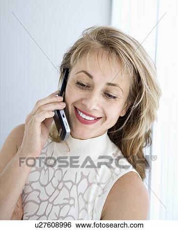 Caucasian woman on cellphone. View Large Photo Image Stock Photograph - Caucasian woman on cellphone.. Fotosearch