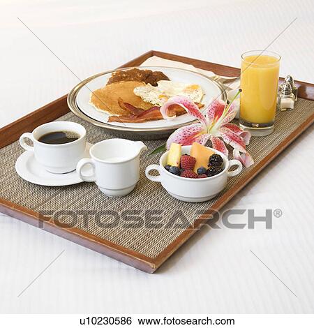 Close-up of breakfast tray laying on white bed. View Large Photo Image Stock Photograph - Close-up of breakfast tray laying on white bed.. Fotosearch