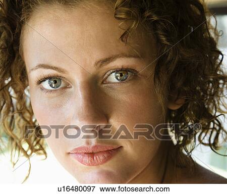 Stock Photo - Close-up of Caucasian young adult female looking at viewer. Fotosearch