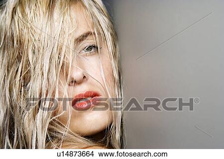 Picture - Close up of pretty woman with long blonde hair. Fotosearch