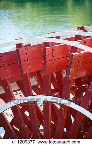Stock Photo - Close-up of red paddlewheel of riverboat in Sacramento, California, USA. Fotosearch