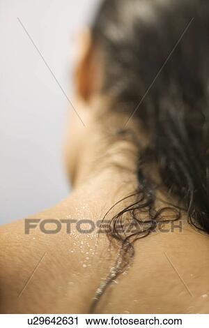 Close up of young woman's wet neck and hair View Large Photo Image Stock Image - Close up of young woman's wet neck and hair. Fotosearch
