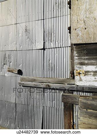 Stock Photo - Close up shot of metal siding on building exterior. Fotosearch