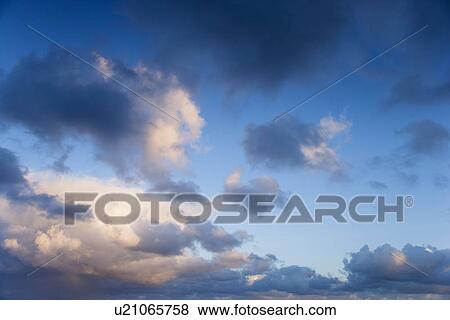 Colorful cumulus clouds in sky. View Large Photo Image Stock Photo - Colorful cumulus clouds in sky.. Fotosearch