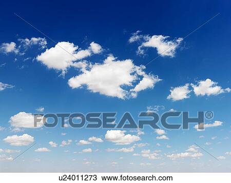 Stock Image - Cumulus cloud formation in blue sky. Fotosearch