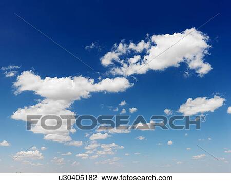 Stock Image - Cumulus cloud formation in blue sky. Fotosearch