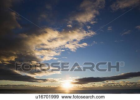 Cumulus clouds at sunset over ocean in Surfers Paradise, Australia. View Large Photo Image Stock Photo - Cumulus clouds at sunset over ocean in Surfers Paradise, Australia.. Fotosearch