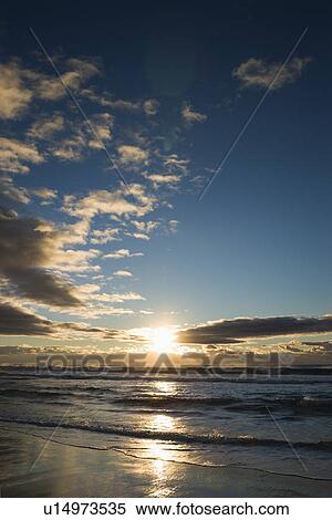Cumulus clouds at sunset over ocean in Surfers Paradise, Australia. View Large Photo Image Stock Photography - Cumulus clouds at sunset over ocean in Surfers Paradise, Australia.. Fotosearch