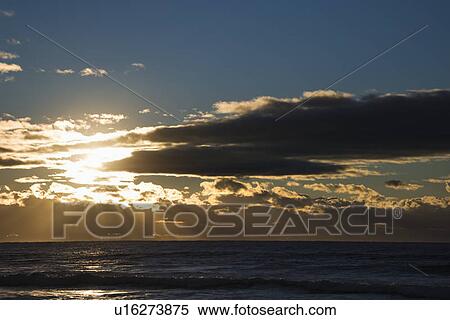 Cumulus clouds at sunset over ocean in Surfers Paradise, Australia View Large Photo Image Stock Photography - Cumulus clouds at sunset over ocean in Surfers Paradise, Australia. Fotosearch