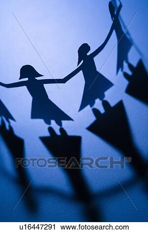 Cutout paper females standing holding hands View Large Photo Image Stock Image - Cutout paper females standing holding hands. Fotosearch