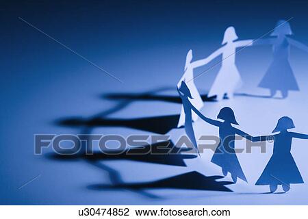 Stock Image - Cutout paper females standing holding hands.. Fotosearch
