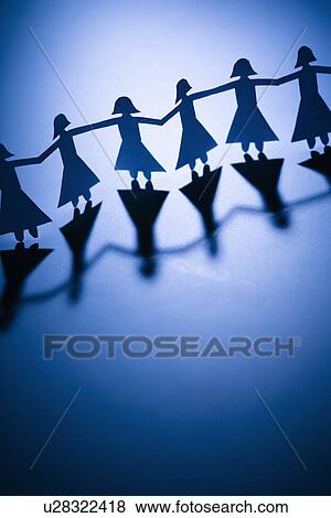 Cutout paper females standing holding hands View Large Photo Image Stock Photo - Cutout paper females standing holding hands. Fotosearch