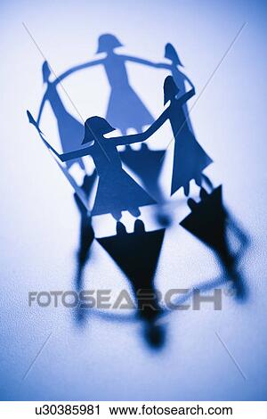 Cutout paper females standing in a circle holding hands View Large Photo Image Stock Image - Cutout paper females standing in a circle holding hands. Fotosearch