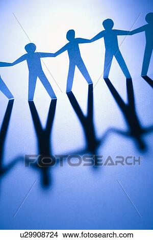 Picture - Cutout paper men standing holding hands. Fotosearch
