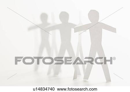 Stock Image - Cutout paper men standing holding hands. Fotosearch