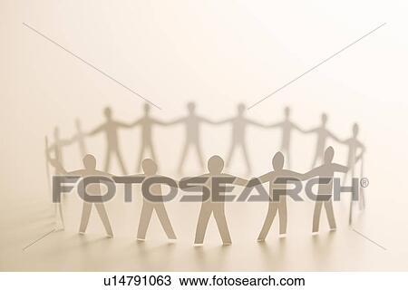 Cutout paper people standing in circle holding hands View Large Photo Image Stock Image - Cutout paper people standing in circle holding hands. Fotosearch