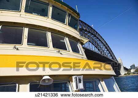 Stock Photograph - Detail of ferryboat in Sydney Harbour beside Sydney Harbour Bridge, Australia.. Fotosearch