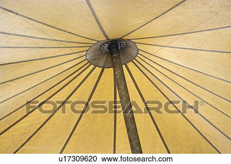 Stock Image - Detail of open umbrella underside.. Fotosearch