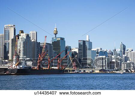 Stock Photo - Downtown Sydney, Australia with view of cargo ship and harbour. . Fotosearch