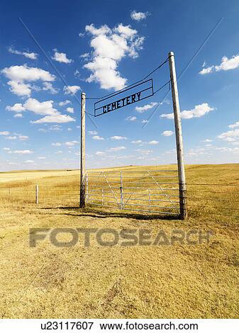 Stock Photo - Entrance with sign for rural cemetery.. Fotosearch